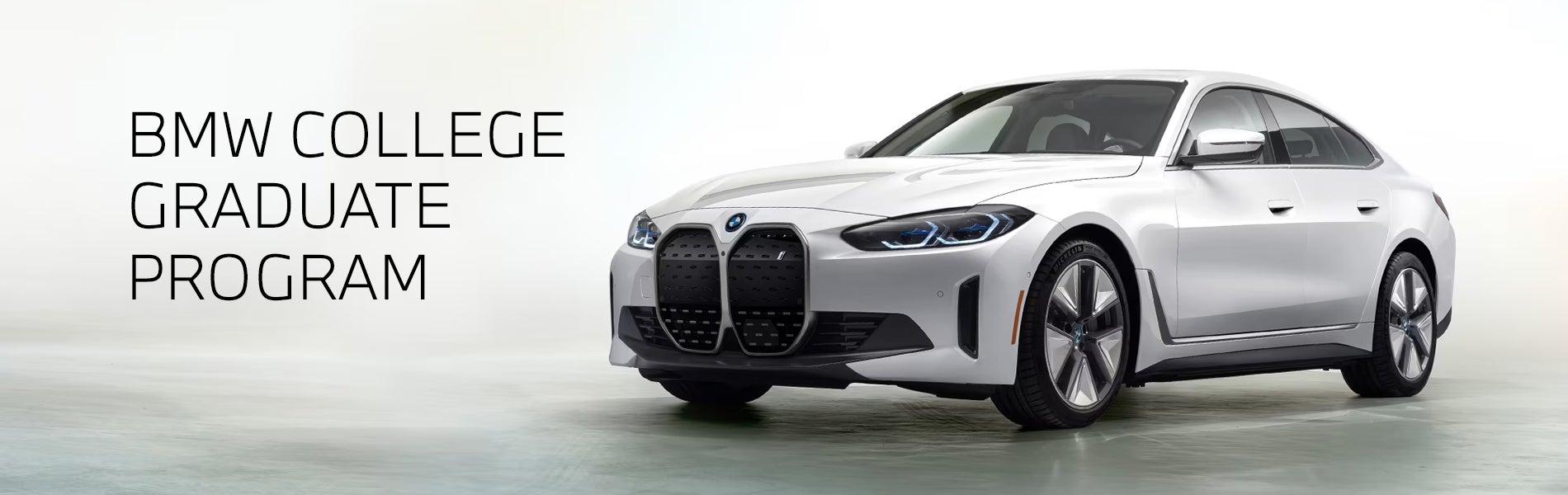 White BMW i4 parked. BMW College Graduate Program. | Competition BMW of Smithtown in St. James NY