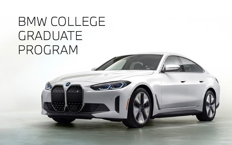 White BMW i4 parked. BMW College Graduate Program. | Competition BMW of Smithtown in St. James NY