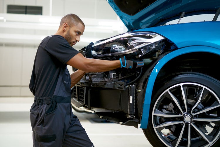 Automotive repair tools in technician's hands