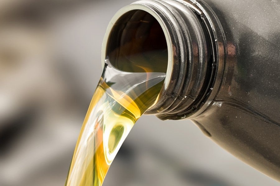 Engine oil being poured from container